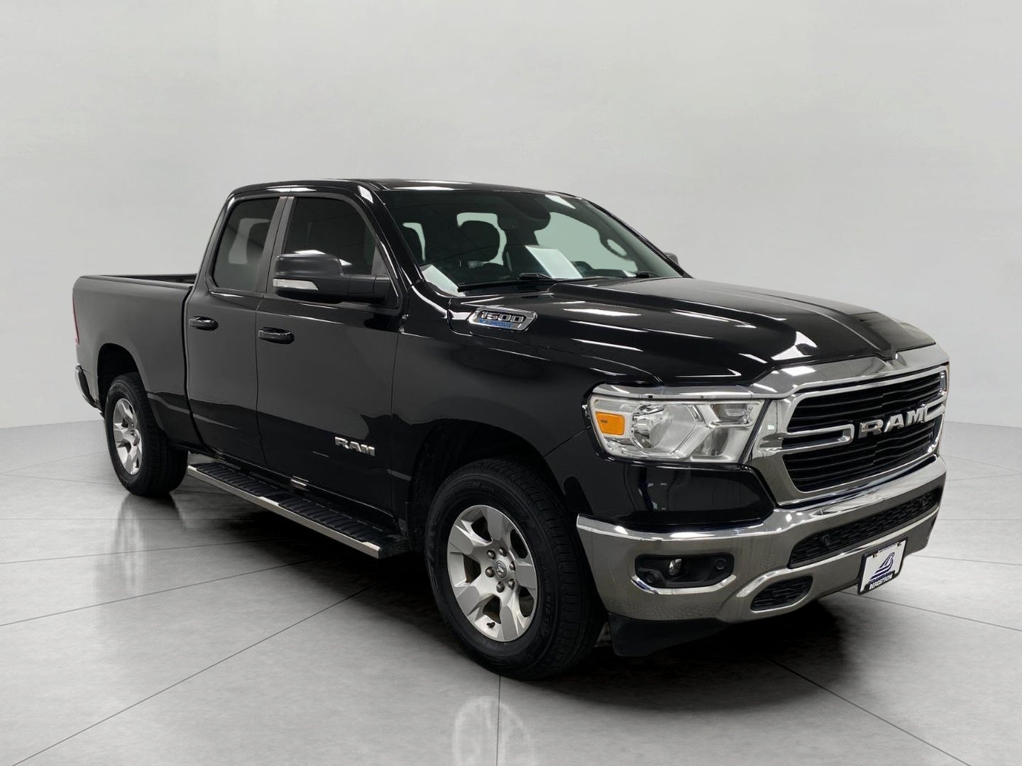2021 RAM 1500 Big Horn 4x4 Quad Cab 6'4 Box in Diamond Black Crystal Pearlcoat — front three-quarter view