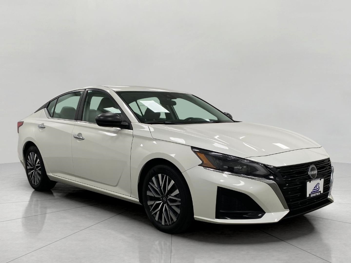 2025 Nissan Altima SV FWD in Pearl White Tri Coat — front three-quarter view