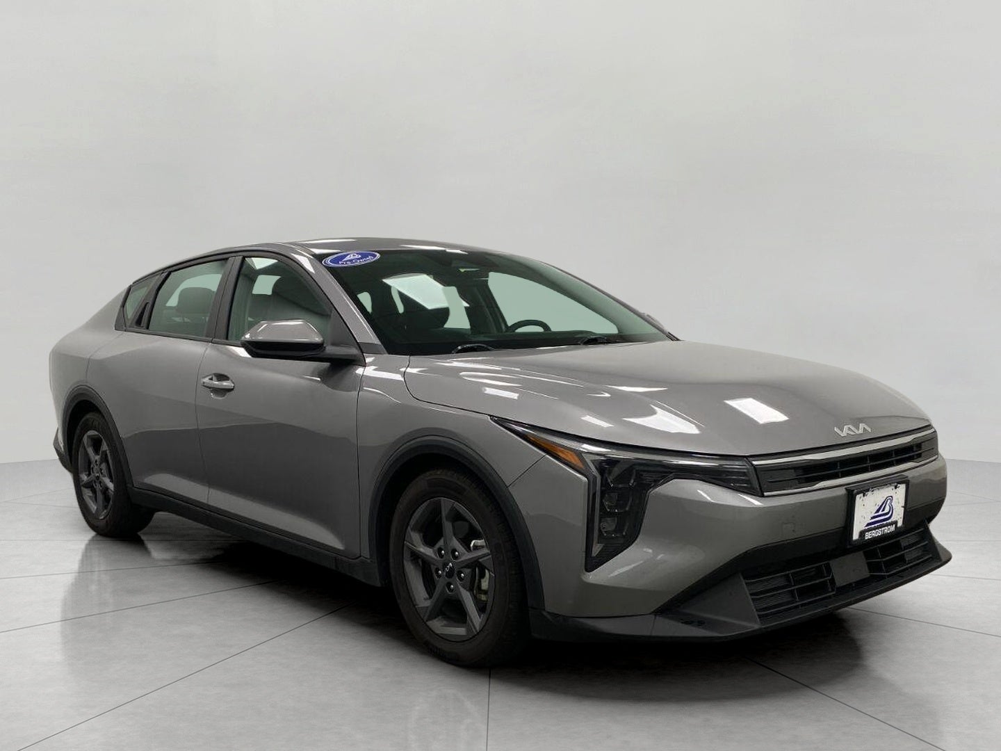 2025 Kia K4 LXS FWD in Steel Gray — front three-quarter view