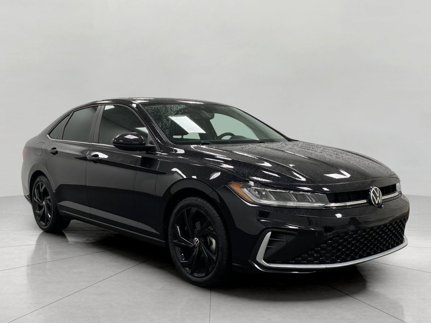 2025 Volkswagen Jetta SE Auto in Deep Black Pearl — front three-quarter view