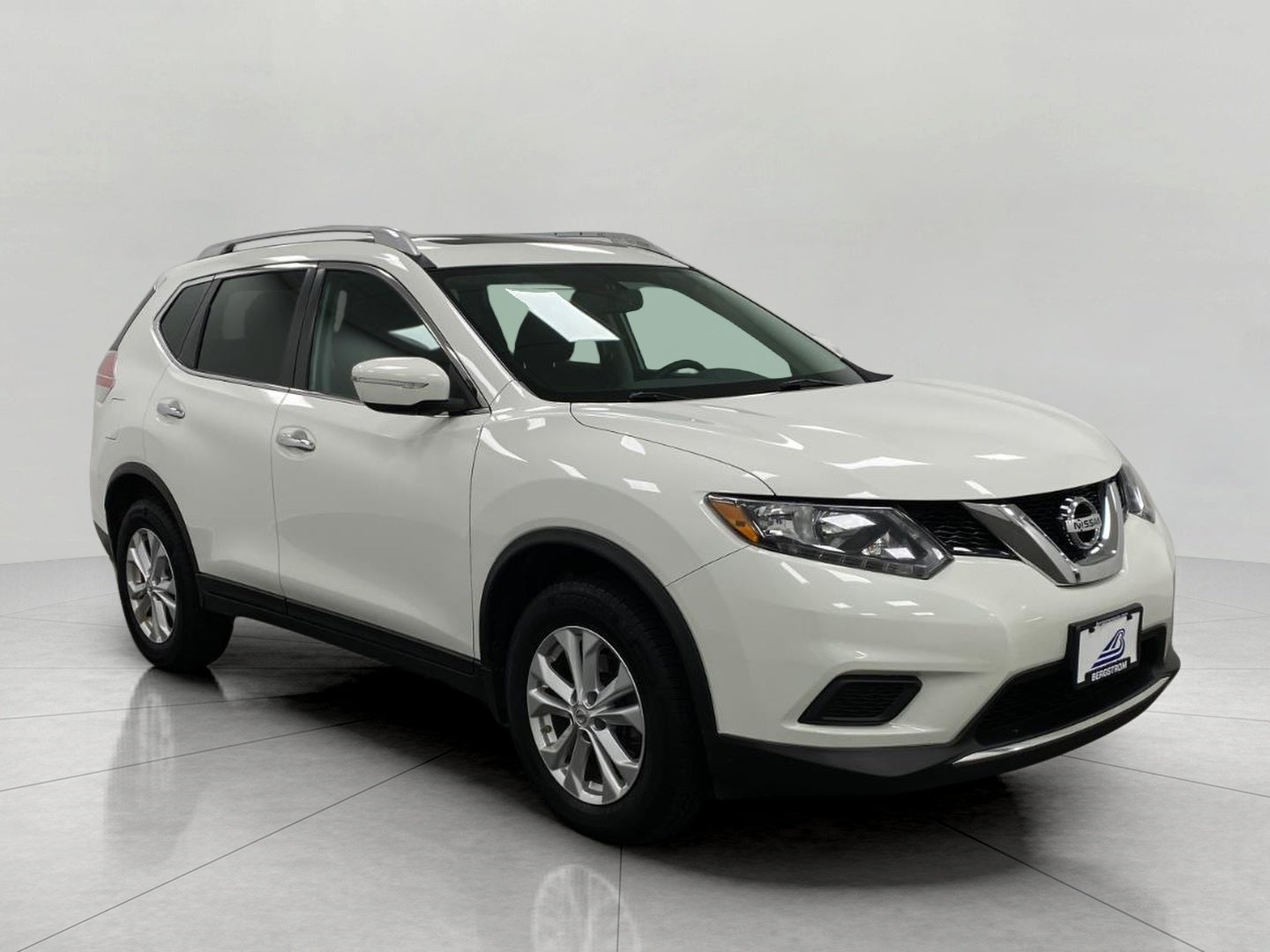 2015 Nissan Rogue AWD 4dr SV in Glacier White — front three-quarter view