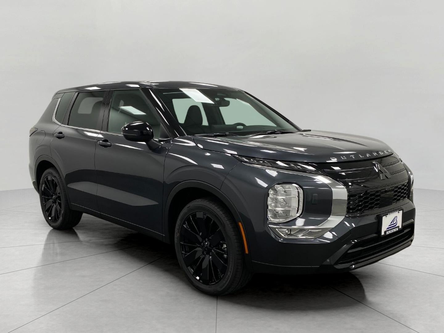 2026 Mitsubishi Outlander LE S-AWC in Graphite Gray — front three-quarter view