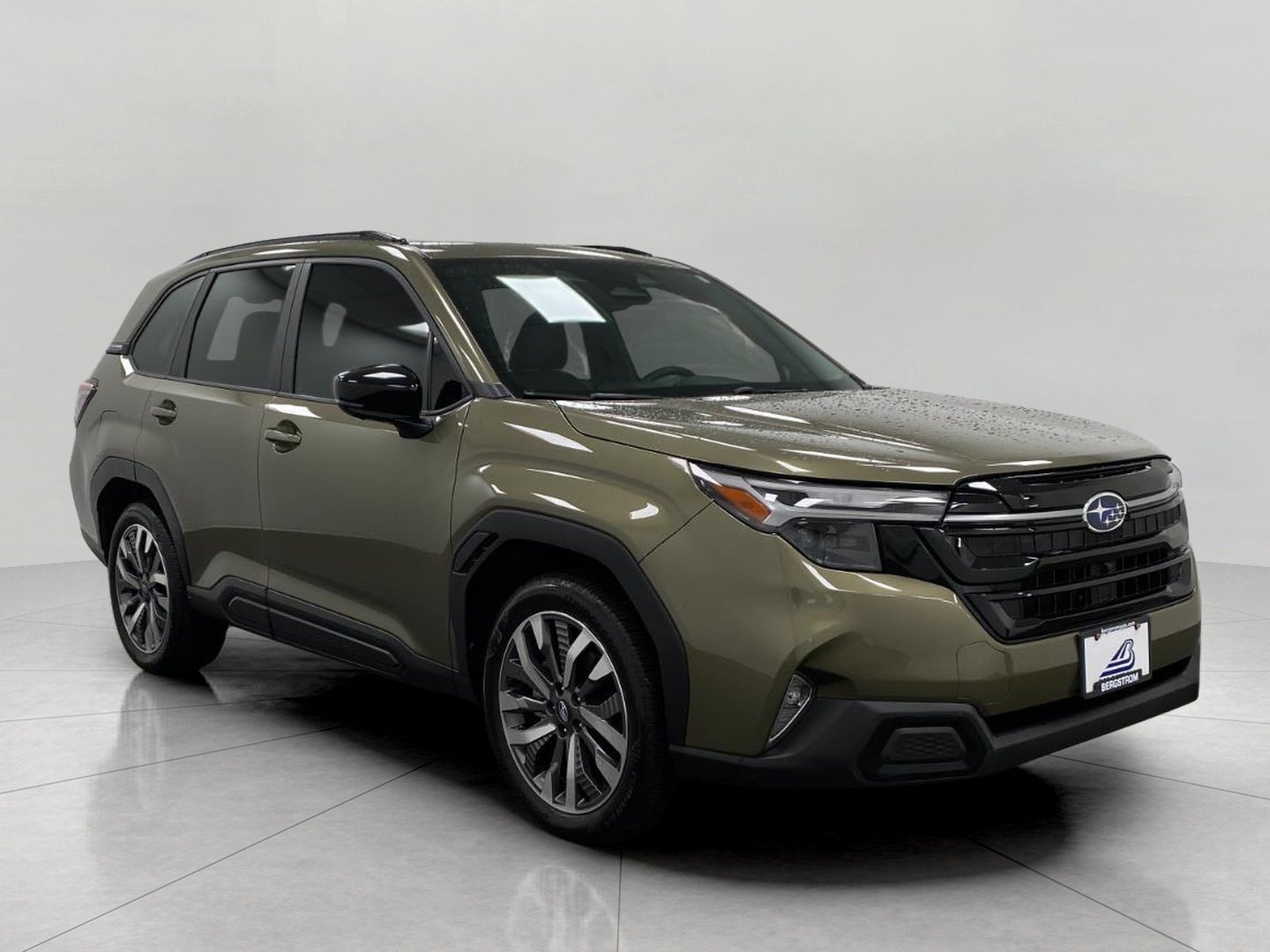 2025 Subaru Forester Touring AWD in Autumn Green Metallic — front three-quarter view