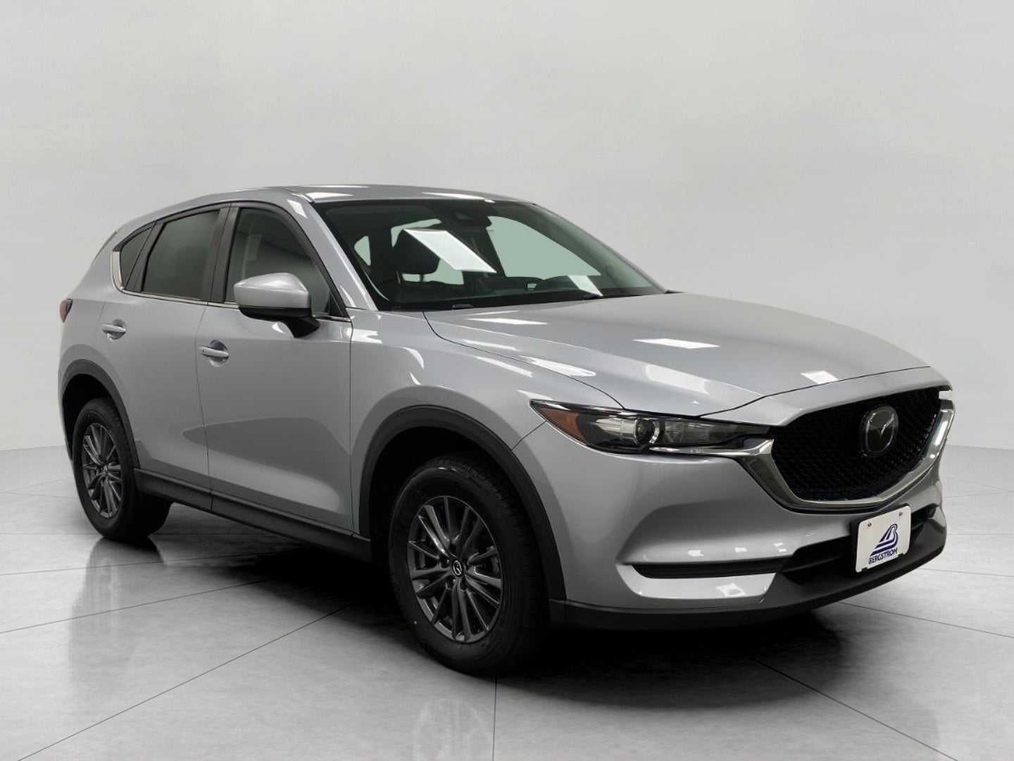 2021 Mazda Mazda CX-5 Touring AWD in Sonic Silver Metallic — front three-quarter view