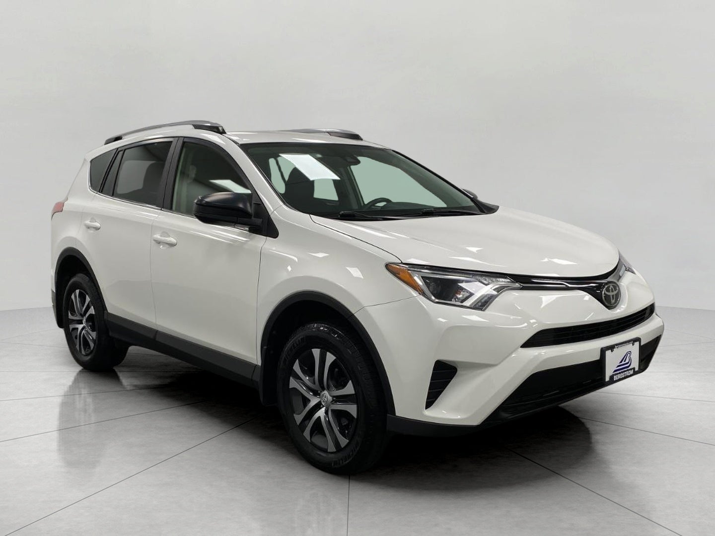 2018 Toyota RAV4 LE AWD in Super White — front three-quarter view